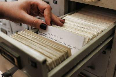 Cropped hand of woman holding document