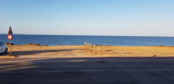 Scenic view of beach against clear sky