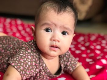 Portrait of cute baby girl at home