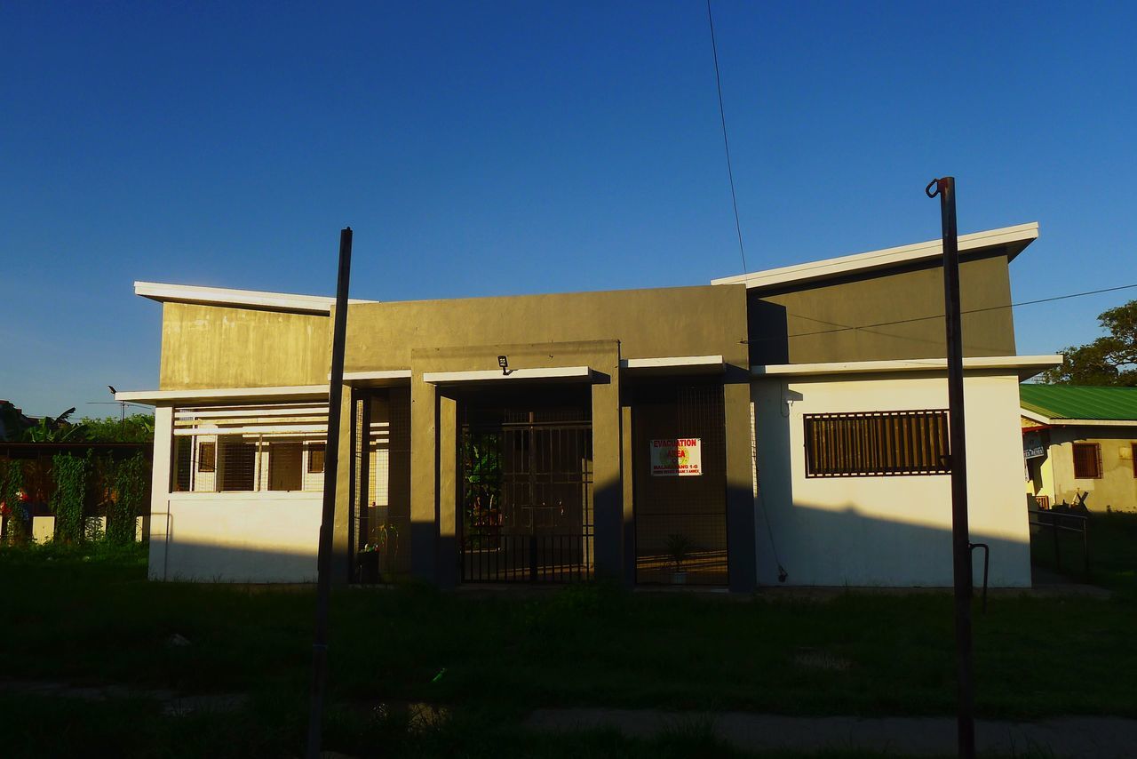 BUILT STRUCTURE AGAINST BLUE SKY