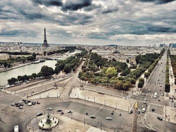 High angle view of cityscape against cloudy sky