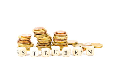 Close-up of coins on white background