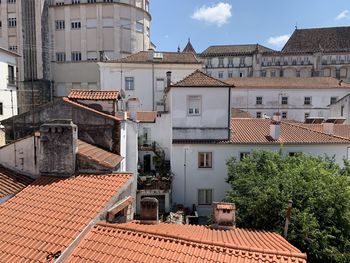 Buildings in city against sky