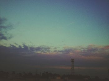 Scenic view of landscape against sky at sunset
