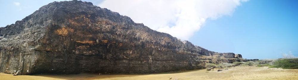 Rock formations on mountain against sky