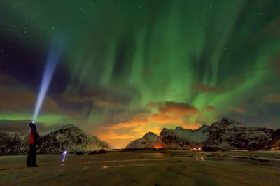 Scenic view of mountains against sky at night