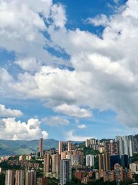 Buildings in city against sky