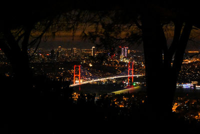 High angle view of illuminated buildings in city at night