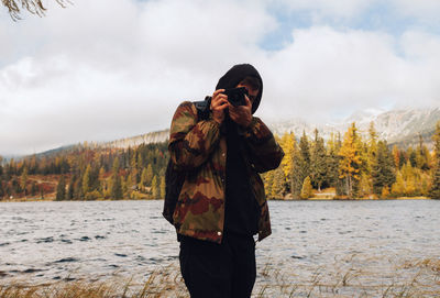 Man photographing through camera