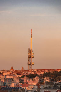 Well-known czech tourist attraction in the capital city of prague. the zizkov tv tower at sunset