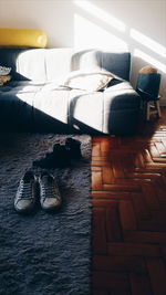 Close-up of shoes on bed at home