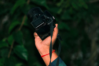 Close-up of man holding camera