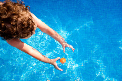 High angle view of girl in swimming pool