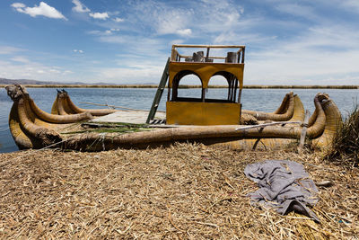 Lifeguard hut on beach against sky