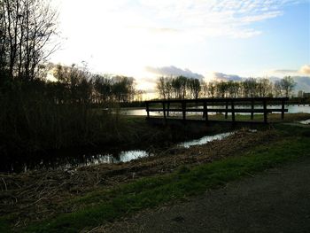 Bridge on field against sky