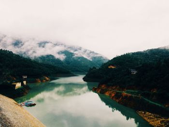 Scenic view of lake with mountains in background