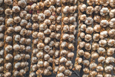 Rope with garlic at the market stall