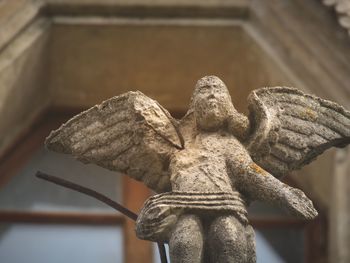 Close-up of angel statue in cemetery