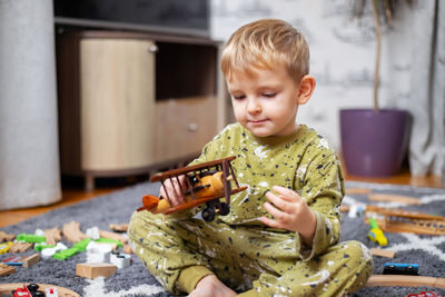 Portrait of cute boy playing with toy