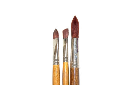 Close-up of colored pencils against white background