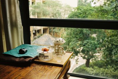 High angle view of breakfast on table against window at home