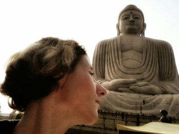 Close-up of woman against wall