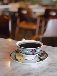 Close-up of coffee cup on table