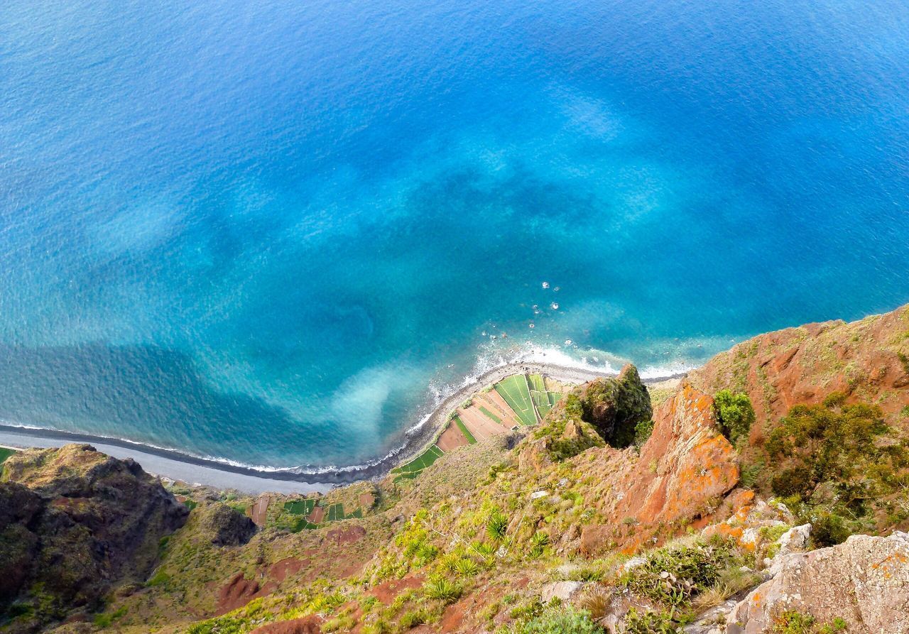 HIGH ANGLE VIEW OF SEA AND MOUNTAINS