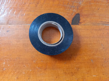 Directly above shot of coffee cup on wooden table