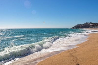 Scenic view of sea against clear blue sky