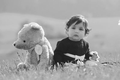 Portrait of cute girl on field