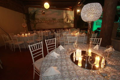 Illuminated lamps on table in restaurant