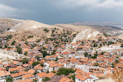 Aerial view of town against sky