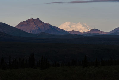 Scenic view of mountains against sky during sunset