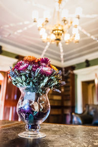 Close-up of flower vase on table at home