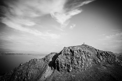 Rock formations on land against sky