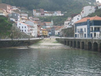 River amidst buildings in town