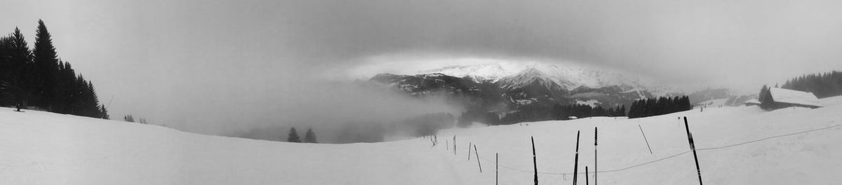 Scenic view of clouds covering mountain