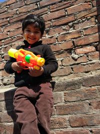 Portrait of boy playing with toy