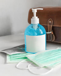 Close-up of green bottle on table