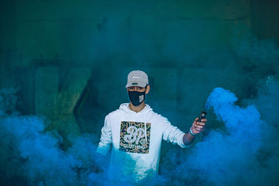 Young man holding smart phone