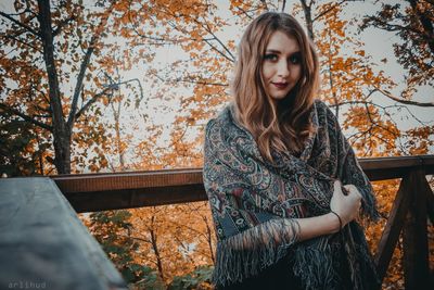 Beautiful young woman in balcony