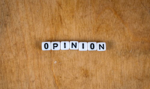 Close-up of text on wooden surface