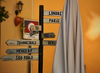 Close-up of information sign on wall