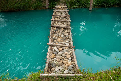 High angle view of swimming pool by lake