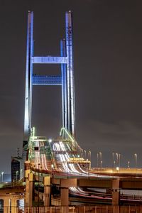 View of illuminated bridge against clear sky at night