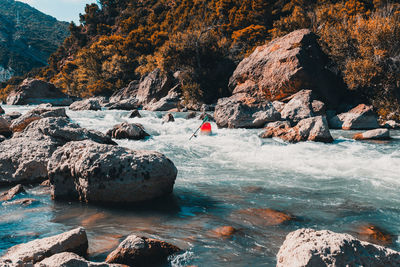 Scenic view of river by mountain