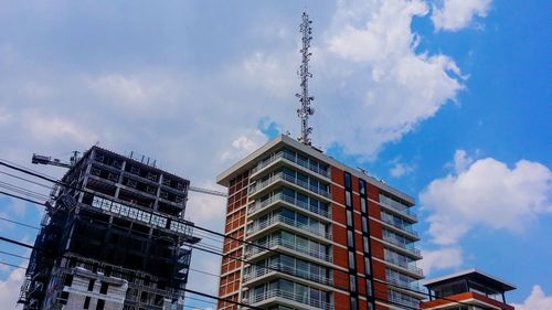 Low angle view of buildings in city against sky