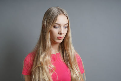 Portrait of a beautiful young woman over white background