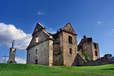 Low angle view of old building against sky